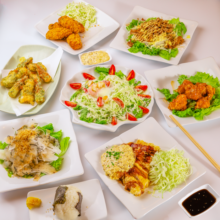 services-02 A delicious assortment of Asian fusion dishes presented beautifully on white plates.